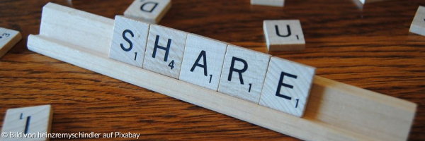 Scrabblespiel mit dem gelegten Wort "Share". 